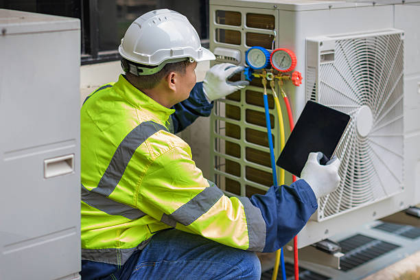 Professional Emergency Ac Repair technician working in Pennville, IN